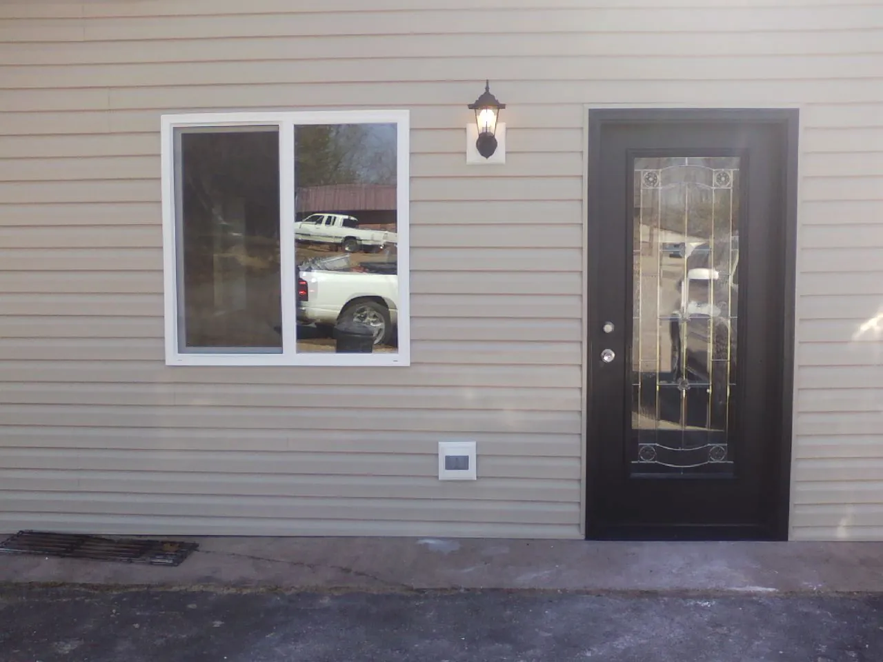 New siding, window and entry door on the side of an addition in Chester Gap